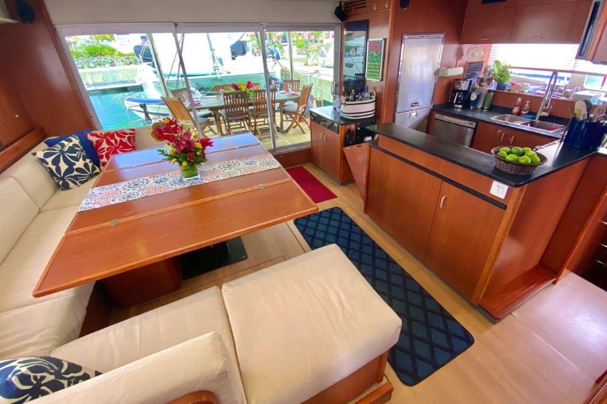 The open aft dining deck is just outside the galley/salon space.