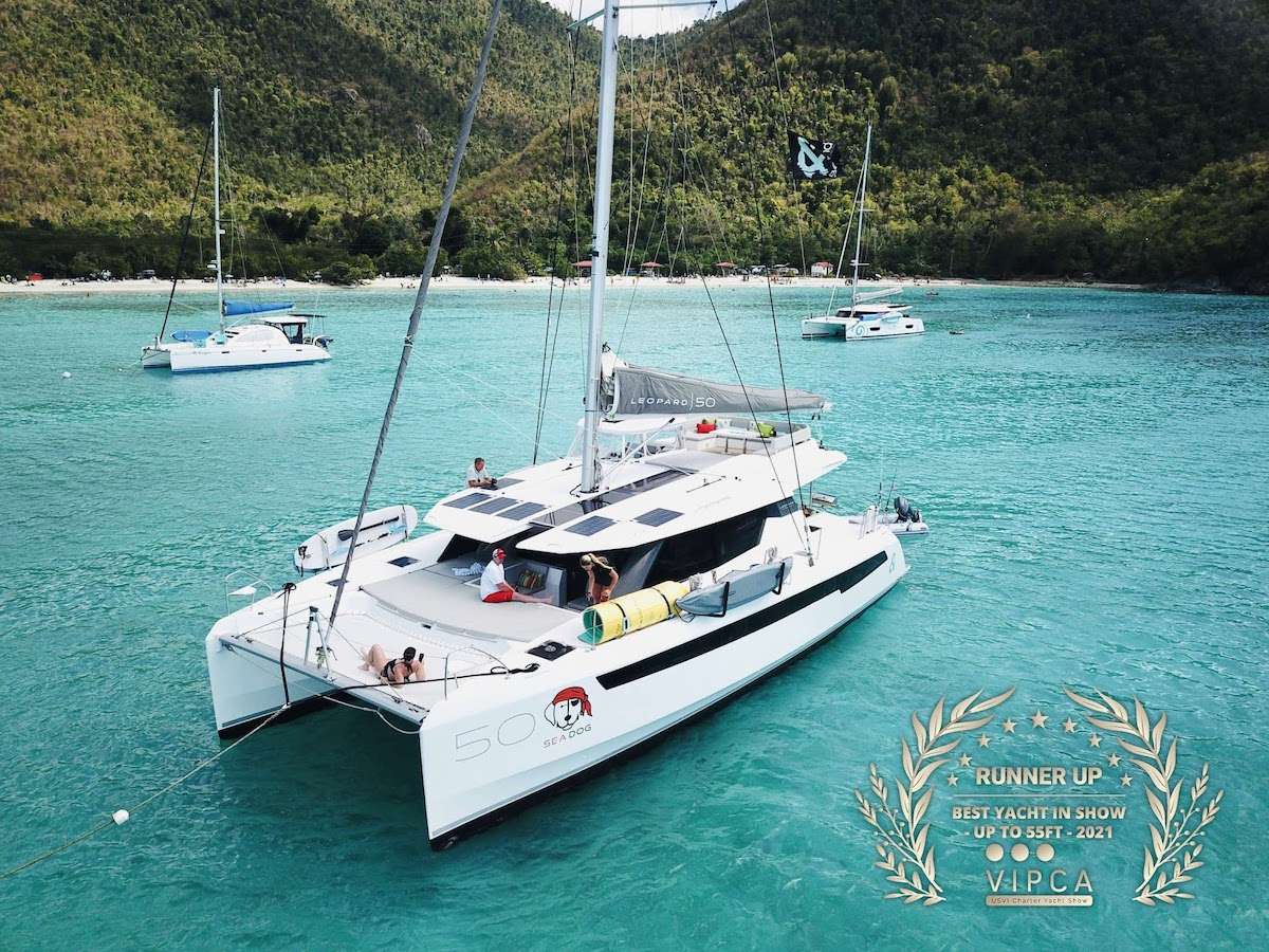 CHARTER BOAT OF THE YEAR - CRUISING WORLD
Lounging around on the flybridge a few steps removed from the helm station on a breezy afternoon in the Virgin Islands is pretty darned enjoyable. In fact so is strolling about the boat and taking in the expansive views from numerous vantage points. On this boat, the great outdoors literally pour into the saloon and sleeping cabins thanks to the wall of glass and overhead skylight that spans the saloon.It offers one master cabin with queen berth, lounge area, en-suite bath and equipped with TV and two additional spacious queen cabins each with en-suite bath.