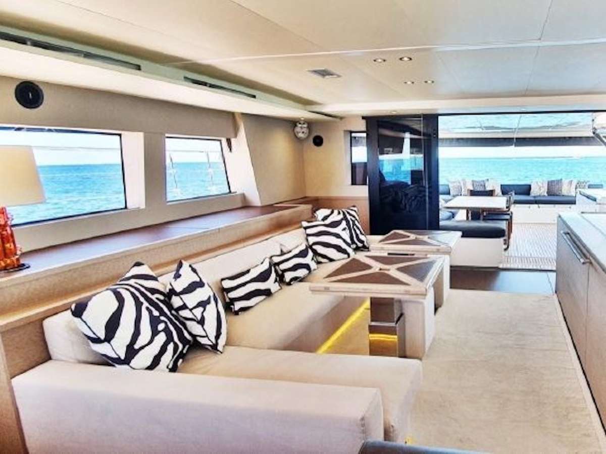With a length of 64-feet and a 33-foot beam, MARE BLU is astonishingly spacious. There are so many seating and sunning options, guests can always find a private space to relax, or enjoy the party together.

The aft deck is 247 square feet, a favorite place to dine and hang out, equipped with a dining table that can seat eight, wet bar and grill. The total inside area is 893 square feet. The head room in the salon, dining area and cabins is 6&rsquo;9&rdquo;.  The entire charter party can relax comfortably on the sofa, and there&rsquo;s plenty of elbow room at the dining table. 

The primary cabin occupies much of the starboard hull. There&rsquo;s a private door to the aft deck, as well as steps down from the saloon. It features a queen-sized, walk around bed and seating area. The ensuite bathroom has dual sinks, a large separate shower stall and an enclosed toilette. The space fills with natural light from multiple hatches and portlights. Three other guest cabins are ensuite with queen beds.

Ride high up on the flybridge for sea breezes and unobstructed views. It is perfectly designed for a group of friends, or a family getaway. There&rsquo;s a seating and sunning area with a folding-leaf dining table to starboard, an outdoor kitchen and bar, and generous sun pads.  In the hardtop, there is a folding fabric sunroof to optimize or minimize the amount of sun coming through.

MARE BLU offers the perfect combination of performance and luxury. She is stable, amazingly roll resistant and very fuel efficient. Whether you are an experienced charter client, or a first-timer, MARE BLU and her talented crew will exceed your expectations.
