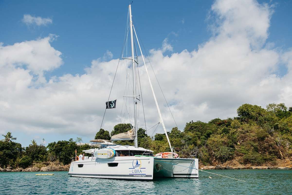 Libra offers sophisticated styling and spacious living areas. Voted Best Boat, this sailing yacht is the perfect vessel on which to share the joy of exploring the most beautiful Virgin Islands with those you love.
A generous sky lounge is enjoyed by guests who may also choose to unwind in the spacious cockpit or on the magnificent sun lounger at the fore, which provides an indulgent all-weather retreat.
The boat’s design provides seamless movement between the cockpit, helm station and the sky lounge, while the incredible space in the saloon evokes the ambiance traditionally found only on much larger yachts