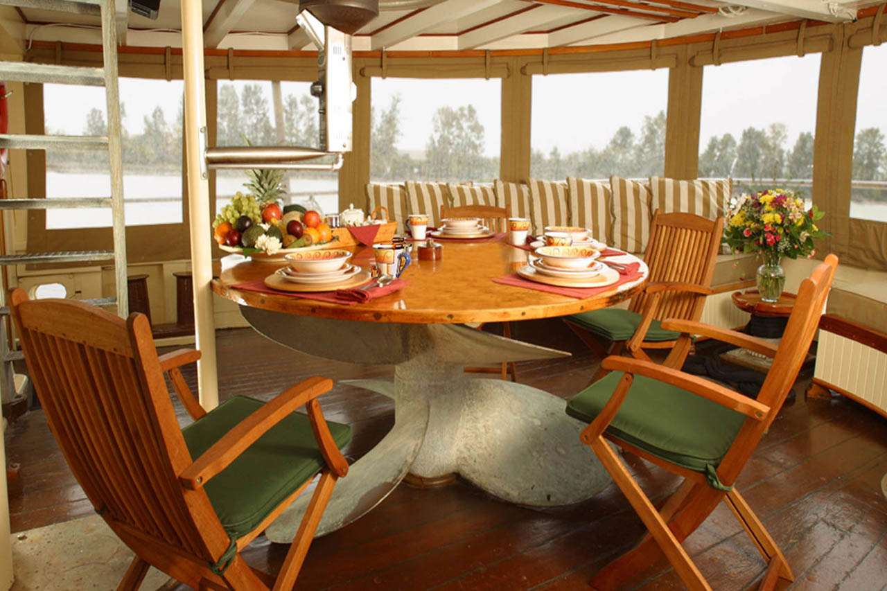 PACIFIC YELLOWFIN Yacht Charter - Aft Deck Dining for 9.  This area can be fully enclosed.
