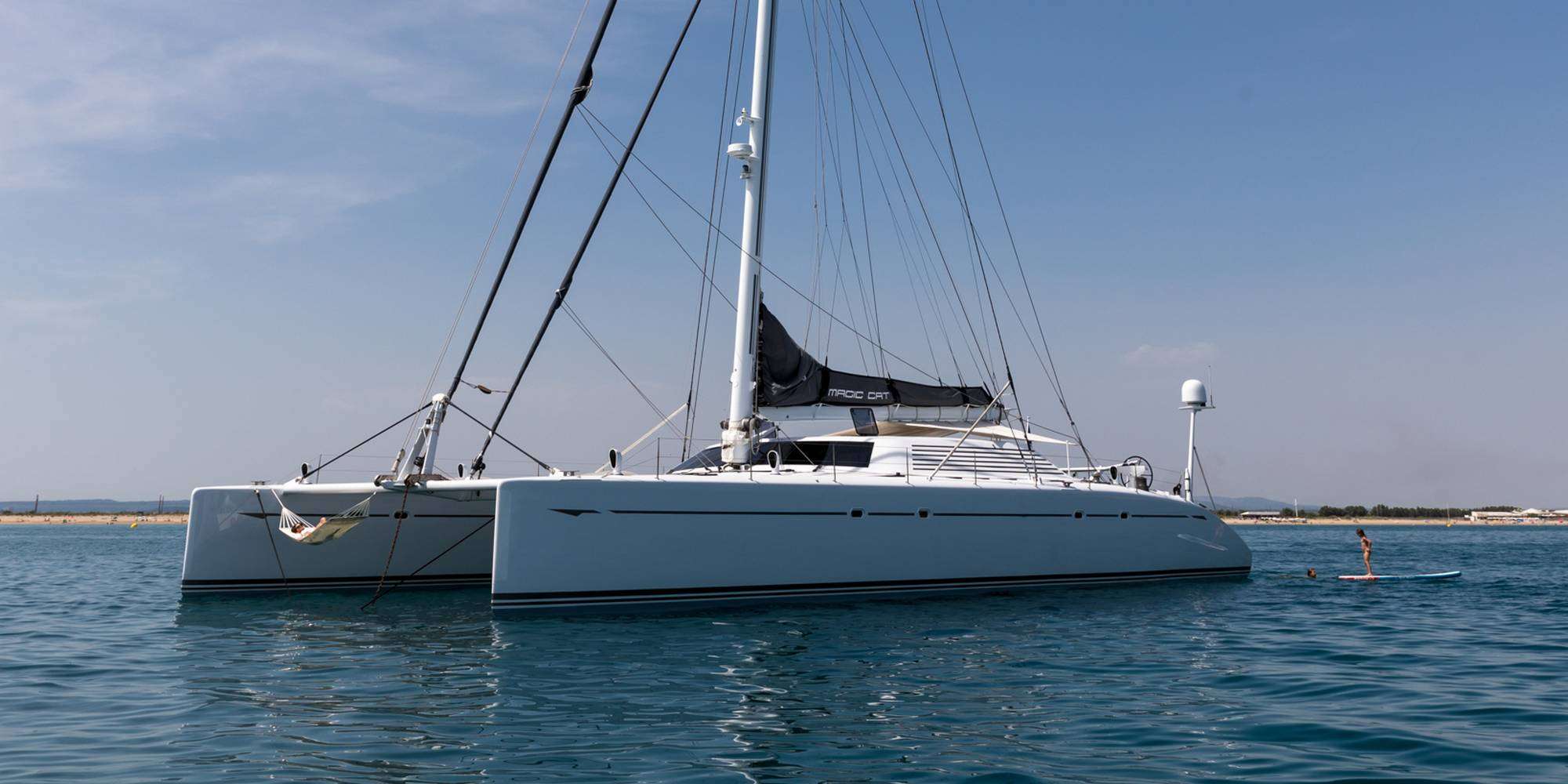 The MAGIC CAT sailing catamaran is not a simple mass-produced yacht. The performance of MAGIC CAT is known to all experienced sailors. This sailing catamaran was built by the Multiplast shipyard, where the racing catamarans 'Orange 2' and 'Groupama 3', two of the fastest boats in the world, were also built! MAGIC CAT was designed by naval architect Gilles Ollier.
The MAGIC CAT catamaran will seduce all sailing enthusiasts, who will be charmed and surprised by the sensations at the helm. The design and the refined style of MAGIC CAT will delight you. Its comfort, stability and safety will guarantee that you will feel at ease on board.