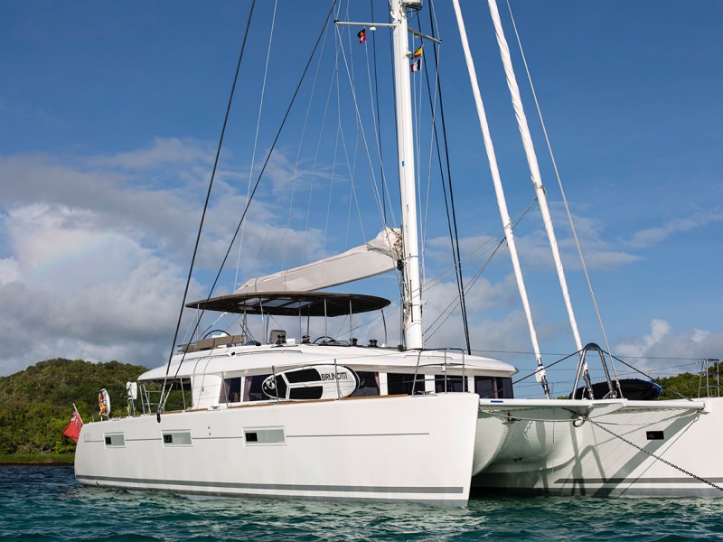 Sail Away is a 2014 Lagoon 620 in pristine condition having just undergone additional refurbishment and upgrades. She is one of the few charter catamarans that can take 10 guests in 5 double cabins with queen beds and en suite bathrooms with seperate showers. She is beautifully equipped with luxurious furnishings and extensive electronics and is the ideal boat for families or groups that want a luxurious, comfortable and fast catamaran.

With respect to water sports, her tenderlift is an ideal sunbathing plateform while its 17" and 90 HP tender is perfect for waterskiing, wakeboarding and kneebording. Besides snorkeling gear, fishing rods with stand, she is also equipped with a flybridge with a cocktail table, cushions, mattresses and a bimini. For Sail Away's scuba diving guests, rendezvous diving can easily be arranged.

Sail Away is available for charter throughout the year. She is based in the British and US Virgin Islands from November through May and in the Grenadines (based in Grenada) June though October. Special arrangements have been made with the exquisite Scrub Island resort in the BVI to allow stress free pick up and drop off of charter guests, minutes from the Tortola airport at Beef Island, where they will be greeted and shuttled to Scrub Island by private launch and pampered as VIP guests with preferential care and exclusive discounts for any stay before and/or after charter.

She has a wonderful crew of 3 who will exceed all your expectations including a renowned chef who will amaze you with her culinary skills and carefully adapt the menu to any dietary restrictions.