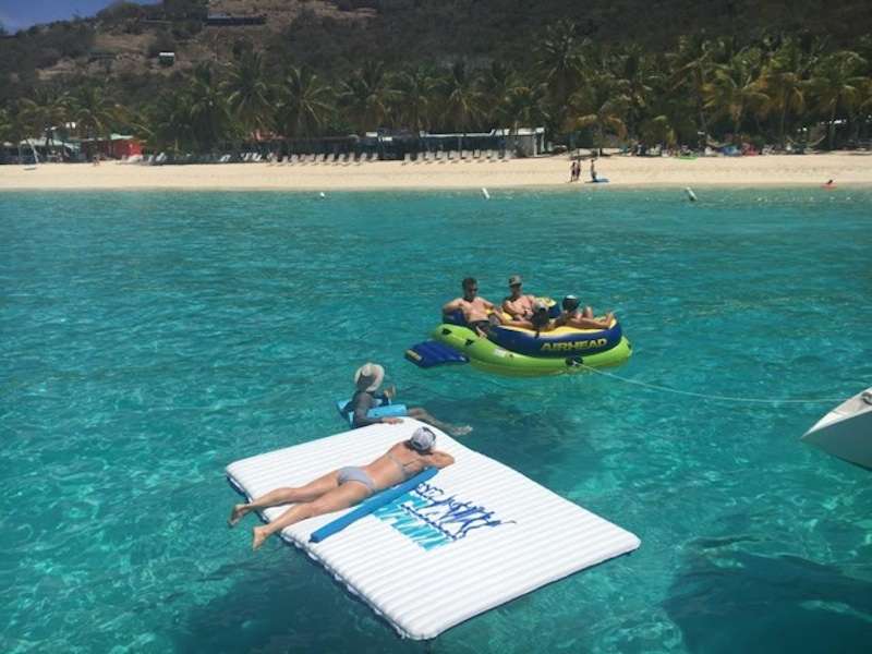 Guests relaxing on floating mats