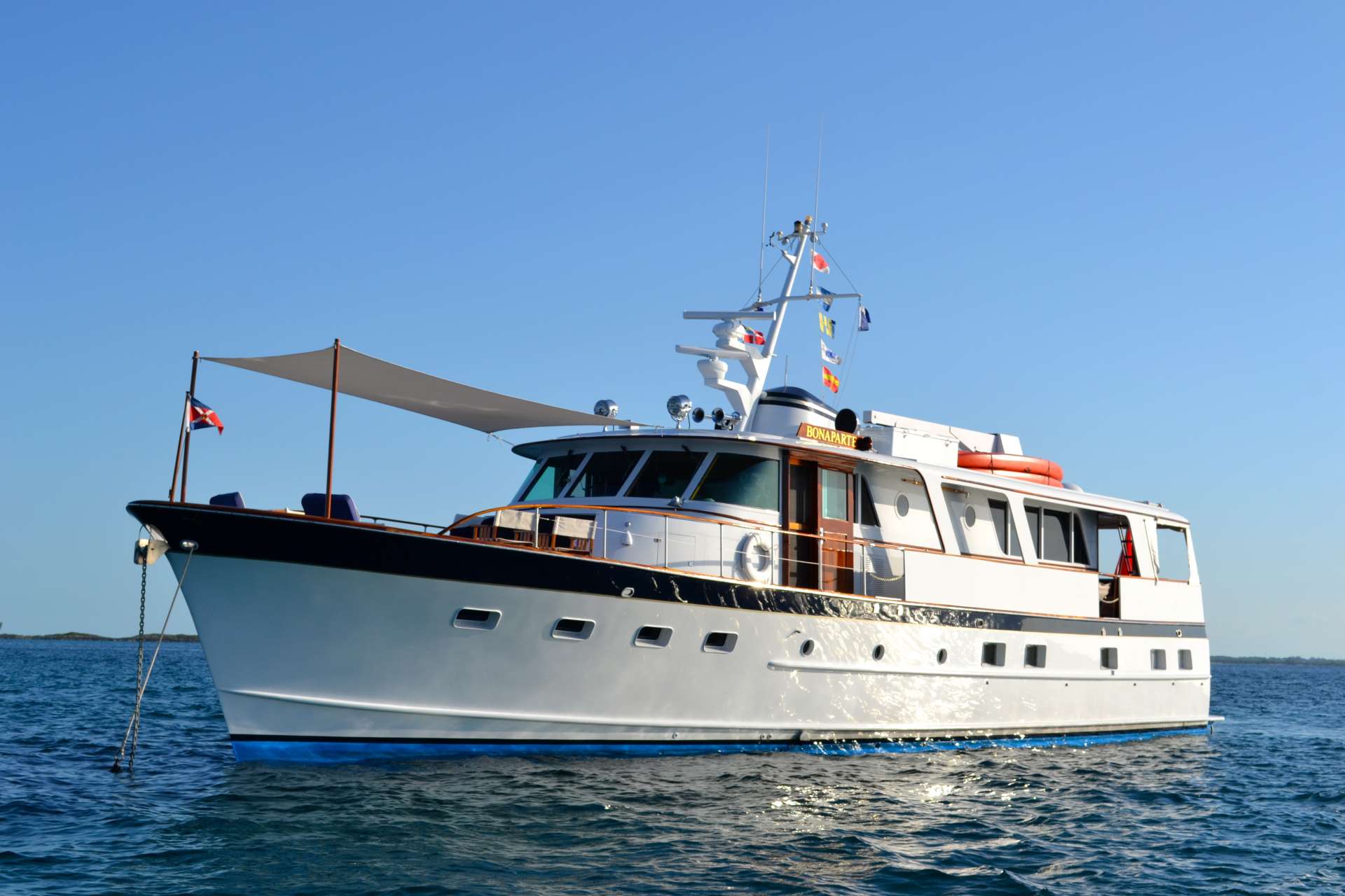 M/V BONAPARTE is a successful charter yacht since 2014 based in Nassau Bahamas. BONAPARTE is owner operated by Capt Francois and Chef Annette plus one additional crew Member for a service level equivalent to a much larger yacht . After an extensive 14 month refit in 2014  she has been maintained in Bristol condition with an extensive yearly refit program since then.

Everyone enjoy the sight of a classic yacht:  The woodwork, the impeccably varnished mahogany cap rail, the timeless beauty of Sparkman and Stevens design. In addition to tastefully decorated accommodations, guests particularly enjoy relaxing on the large forward teak deck protected by a sun awning. Guests stretch out on the cushioned bow seats to read, relax and daydream in the balmy breezes.  A teak table and captain's chairs are easily set up for comfortable dining for 8 on the foredeck.  The weather-protected aft deck is the ideal romantic setting for al fresco dining with newly upholstered seating for up to 10 people.

M/V BONAPARTE provides well-appointed accommodations for 6 guests in 3 aft cabins:  The en suite master has a King bed, the VIP has a Queen and the guest cabin has a double bed.  The VIP and Guest cabin share the second head and shower. all cabins have individual A/C controls.  Granite counters and vessel sinks add a contemporary touch of luxury.

Annette and Francois have been manning this ship for the last 6years. they are very personable and congenial hosts. Sophisticated, outgoing and discrete, they are always attuned to their guests' moods. They enjoy sharing their passion for yachting, creating memorable moments and pampering their guests from sun-up to sundown. They have found all the best anchorages and snorkeling spots in the Exumas and have become friends with many charming Bahamians who enjoy sharing all the islands have to offer with visitors.

Annette and Francois excel in creating a magical atmosphere on board, helping their guests to 'decompress' from their demanding lifestyles and reconnect with their inner child.  'Playtime in paradise' starts early in the day and continues well into the evening onboard M/V Bonaparte.  Enjoy the Bahama's crystal clear waters to the fullest with all the water toys - snorkel gear for everyone, 2 tandem kayaks, 2 SUP's for exploring and a dive compressor for Certified divers.

M/V BONAPARTE has stabilizers and cruises at 9 knots with economical fuel consumption of 16 GPH.  AC throughout. 