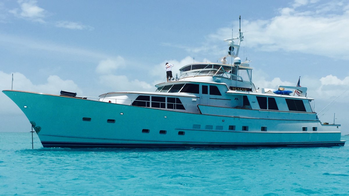Motor Yacht SEAFARI was built in 1975 by Burger Yachts and has had major refits  through the years with ongoing upgrades.  This luxury yacht’s architecture & engineering are the signature work of Jack Hargrave.

Timeless styling with large windows throughout her interior space offer abundant natural light & panoramic views.  The colors of the sea flow into the azure blue & turquoise palette of SEAFARI’s beautiful interior décor which is accentuated by a wonderful collection of antique furnishings & alluring objects d'art.

Onboard the SEAFARI, there is ample outdoor living spaces await, including a lowered aft deck and an extended swim platform, ideal for seamless enjoyment of the waters. The foredeck boasts built-in seating and a sunbathing area. Up on the upper deck, guests can indulge in alfresco dining with options for both shade and sun.

Inside, warm wood panels complement contemporary flooring and plush furnishings. The salon is outfitted with generous seating, including lounge recliners, sofas, a coffee table, and a casual dining area. A foyer to starboard leads to a day head, galley, and a spacious private dining area. Panoramic windows flood the main deck with natural light, creating an inviting and scenic atmosphere. Below deck, three guest cabins offer private en-suite facilities for added comfort and convenience.
