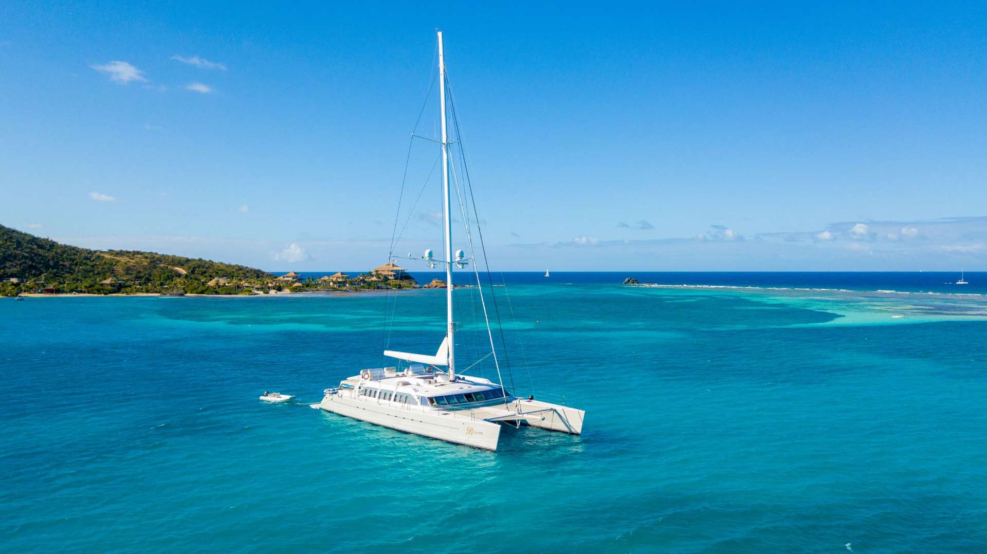 BELLA VITA, formerly NECKER BELLE, was designed to maximize fun, with a spacious trampoline, a diving board and knowledgeable fun charter crew! Whether you’re an adrenaline seeker who's into sailing, diving, paddle boarding or fishing, or you're just looking for some serious sun tanning space, BELLA VITA is the charter yacht for you.
Great sailing performance, combined with beach club styling and a carefully conceived layout, create a versatile living arrangement for eight to ten guests. BELLA VITA's interior is large and contemporary, with bamboo wood flooring and accent lighting in all the right places. She offers guest accommodations via four chic staterooms, with a master suite, a double cabin and two double/twin convertible cabins. A Lower deck Twin Cabin is also available for family charters with private head and use of the Day Head/Shower. Best suited for families.