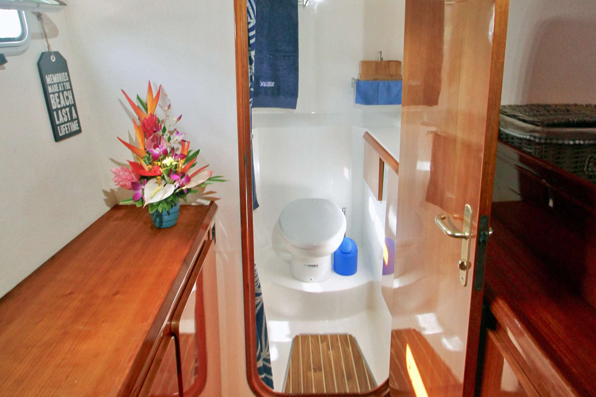 ISOLABLUE Yacht Charter - Entry to Port Fwd Guest bathroom