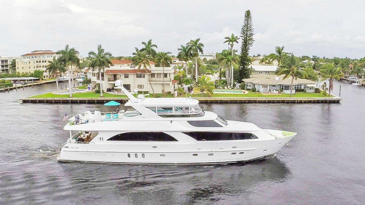 From the moment you step on board, you will be amazed by the abundance of space this 101 foot yacht provides. She offers an inviting atmosphere for friends and family to gather together both in celebration and in everyday living. Built by Hargrave with delivery in 2010, she received a complete interior refit in 2013 and more updates in 2018. Accommodation is for eight guests in four cabins consisting of 2 master staterooms,  a main-deck King suite, and  a full-beam king suite.  She also has 2 twins staterooms which can  convertible to queen size doubles. This is a fantastic yacht for 4 couples! All cabins have entertainment systems including flat screen televisions and all have full en-suite bathroom facilities.The main saloon features cherry gloss and camphor burl wood joinery and is designed with contemporary angled cabinetry .These 45 degree angles are mirrored in the main saloon and dining ceiling soffits. Inside the soffits is a band of beveled mirrors that give the illusion of a much higher ceiling. The overall mood is clean, modern and very comfortable. There is cherry gloss crown molding throughout the main saloon with the air conditioning system streamlined throughout, hidden using the crown molding. The port aft corner houses a 50-inch Sharp television and an audio/visual system including Blu-Ray DVD and a Marantz surround sound system.
The flybridge features a huge horseshoe seating area on the port side and the bar with its teak edged light marble top and seating for four gives plenty of open space for cocktails and al fresco dining and there are sun pads for relaxing next to the Jacuzzi. There are two teak cocktail tables with sun dial inlays and cross grained patterns in front of the horseshoe seating area and a large gas grill is located to port, aft of the sun pads.
