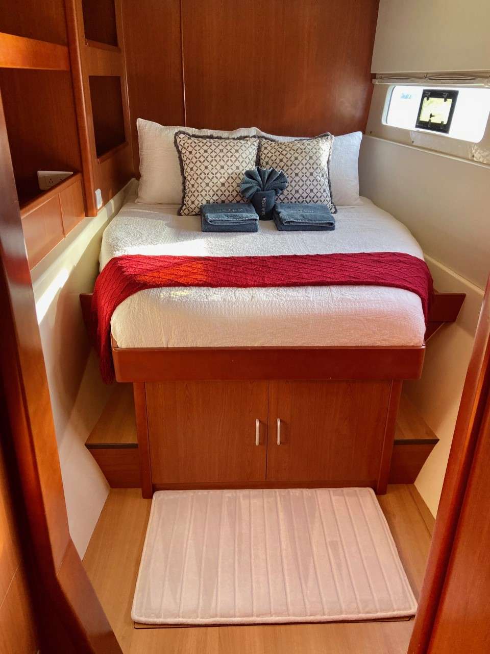 Lower level guest stateroom with opening hatch and port light for ocean breezes.