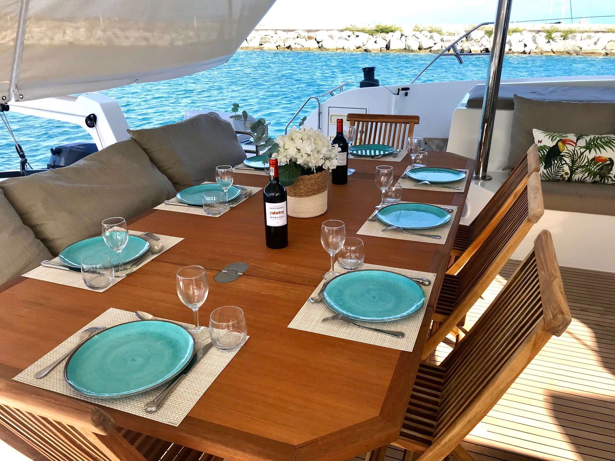 ENCHANTE Yacht Charter - Teak dining table with sun cover deployed