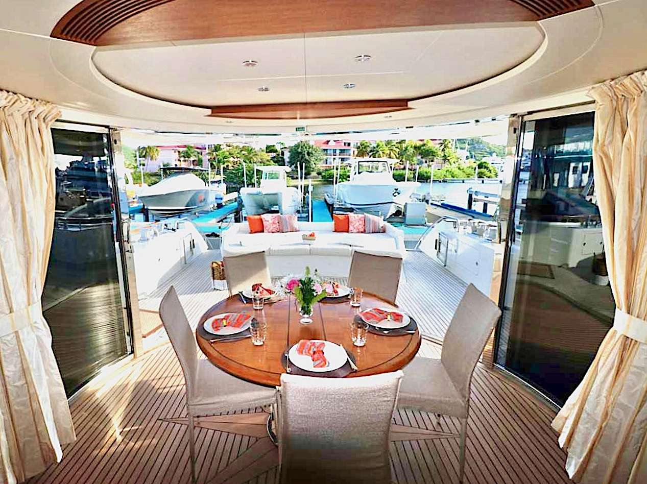 ECLIPSE 114 Yacht Charter - Aft deck enclosure and lounge, table leaf can be added for large groups