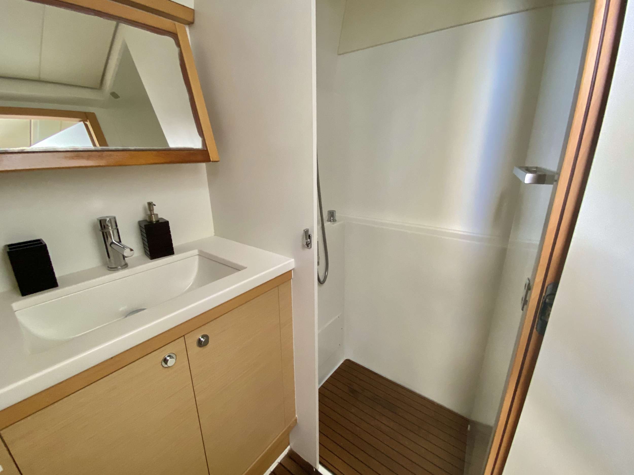 RUMBA Yacht Charter - Guest bathroom with dry shower stall