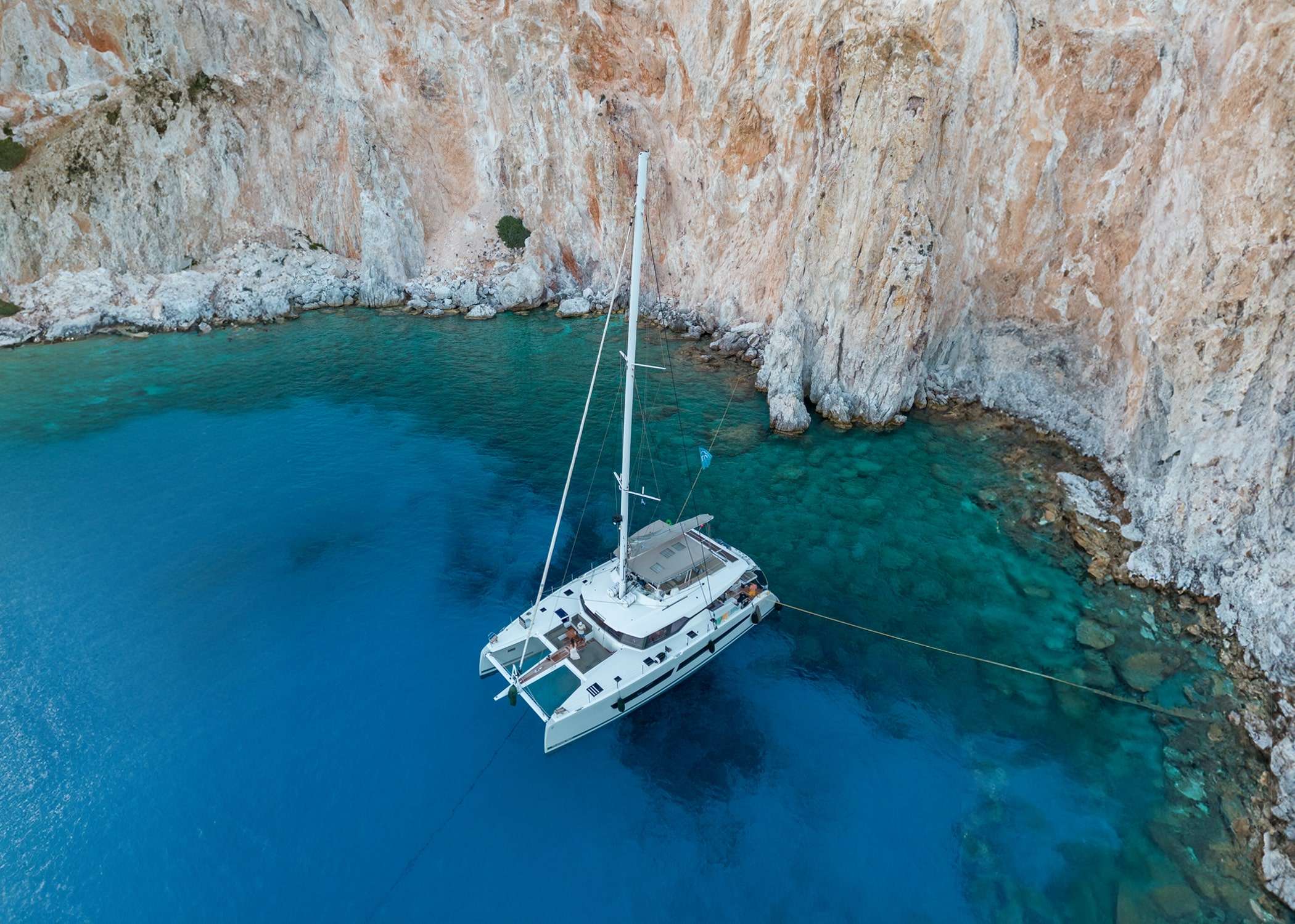 S/Y Serenissima is pure luxury in a catamaran her expansive flybridge with an authentic ocean terrace and a forward cockpit with extensive seating area are just some of her hallmark features. Experience the exhilaration of sailing or simply relaxing on the decadent lounges or sunbathing beds. Her stunning interior is boldly modern and incredibly spacious to deliver the ultimate in comfort and luxury. She accommodate 10 guests in five cabins - one owner's suite and 4 queen bed cabins all with private bathrooms.
The flybridge together with the forward deck offers plenty of space for sunbathing and relaxing and the aft cockpit a great area for socializing and alfresco dining. Our crew consisting of a captain, hostess and chef will look forward to pampering guests on board without leaving any wish unfulfilled. Serenissima is committed to offer all our distinguished guests a calm and luxurious environment.