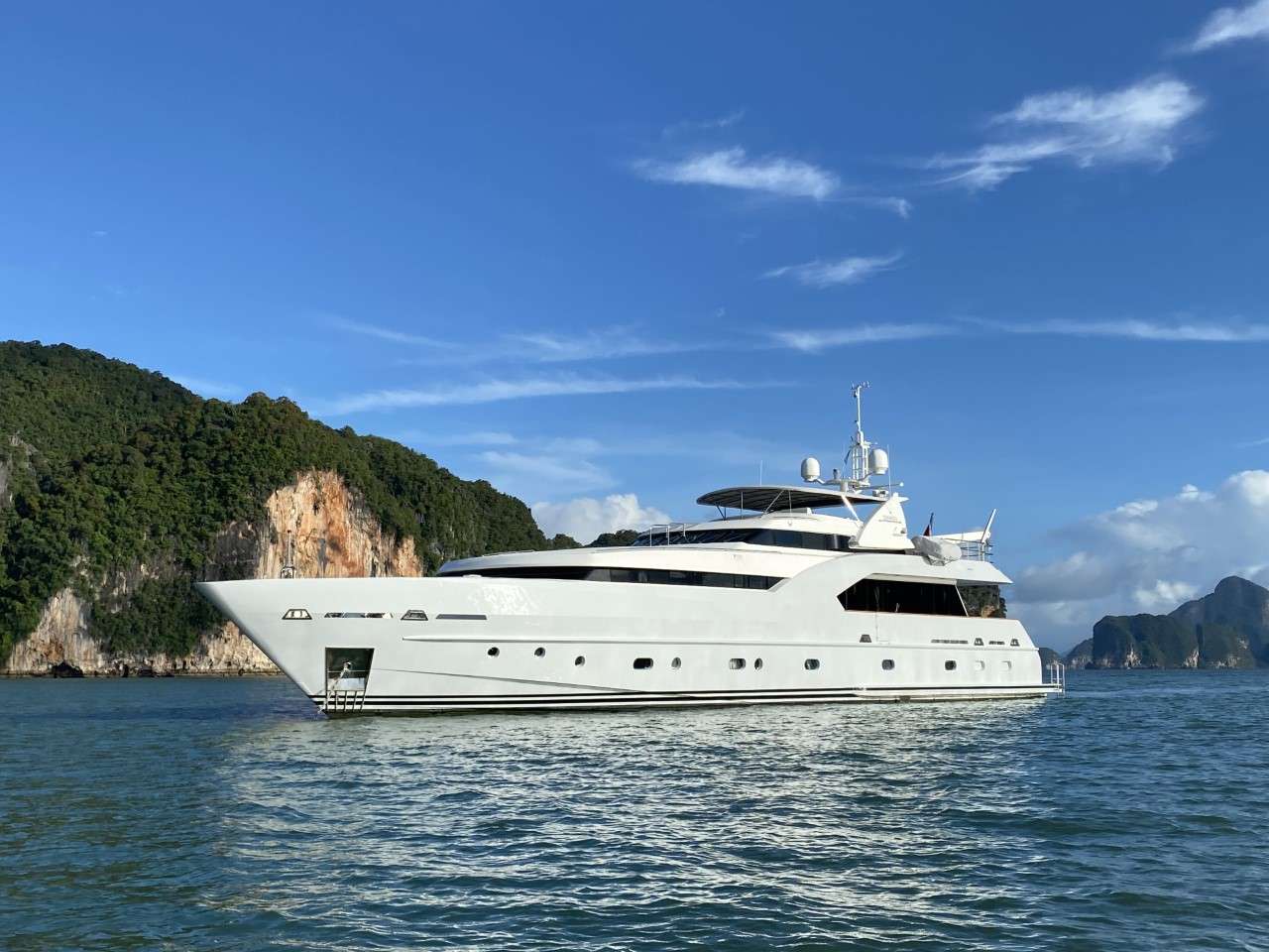 The 111.5-foot (34m) XANADU has been fully refitted over a two-year period to the highest of standards. Relaunched November 2021, all machinery has been completely overhauled, exterior has been resprayed in a stylish 'Whisper-Grey' shade, she's been fitted with new teak decks and all systems have been upgraded. Her fresh, new exterior furnishings, updates to the interior and functional lay-out allow for sophisticated entertaining, socializing and dining.

The yacht's timelessly elegant interior showcases rich high-gloss cherry woods and plush furnishings, to create a stylish and welcoming ambiance. The formal dining is uniquely located aft of the main salon, offering guests a wonderful dining experience while enjoying exceptional views.

XANADU welcomes eight guests in four luxurious staterooms. Her full-beam, main-deck master suite is fitted with a skylight to dazzle stargazers and includes a private office with optional sofa bed for an additional guest. The master has a king-size bed and lavish en-suite bathroom with gold-plated fittings. The stately yacht&rsquo;s additional three spacious double-bed staterooms located on the lower deck, are complete with their own en-suite bathrooms.

Motor yacht XANADU&rsquo;s flybridge provides space for yoga sessions, massage, and lounging with family and friends. Complete with a bar, barbeque, sun pads, alfresco dining and sensational views of the cruising destination, everyone will enjoy time spent on deck.

To further unwind, XANADU features a sauna on the lower deck, providing leisurely relaxation. Her wide range of water toys include two underwater scooters, Yamaha FX Cruiser and an inflatable dock with netted pool.

XANADU is equipped with stabilizers ensuring a comfortable time on board.

XANADU's cruising locations in SE Asia include Thailand, Malaysia. From June to October she may be available the Anambas Islands of Indonesia upon request, conditions permitting.