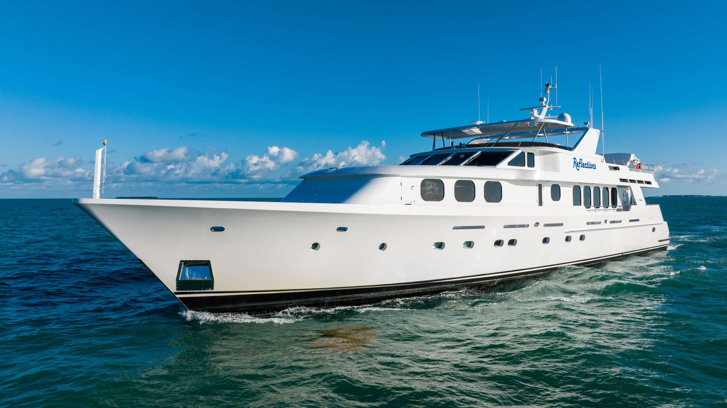 This is the third charter yacht REFLECTIONS for her proud owners. They began yachting with an 85' Pacific Mariner, then a 107' Christensen and are now happy to be offering the five stateroom, 124' Christensen for charter. They love Bahamas cruising and are currently outfitting REFLECTIONS with a new updated interior, full list of water toys, towed tender and of course a proven, experienced charter crew. The space on board this 124’ yacht is immediately felt in her width and her layout. REFLECTIONS aft deck dining and lowered bar area offer space for the entire group. Entering the main salon, you are greeted by a cheerful fish aquarium, spacious, comfortable salon with bar and formal dining. Moving forward on deck, enter the master stateroom with king bed and his and hers open master bathroom including a shower and Jacuzzi tub with plenty of natural light. Below are four additional staterooms, all with en-suite bathrooms and comfortable amenities for guests. There are three queens for couples and a room with twin beds as well. Upstairs on the fly bridge, be treated to a highly customized deck area and the most popular spot on board. REFLECTIONS expansive fly bridge offers three captain’s chairs, a full dining area, bar, BBQ grill, huge Jacuzzi and sun pads, a hammock for the ultimate relaxation, sun lounges aft when the toys are in the water and all with the choice of shade or sun. Come enjoy all the Bahamas and REFLECTIONS have to offer!