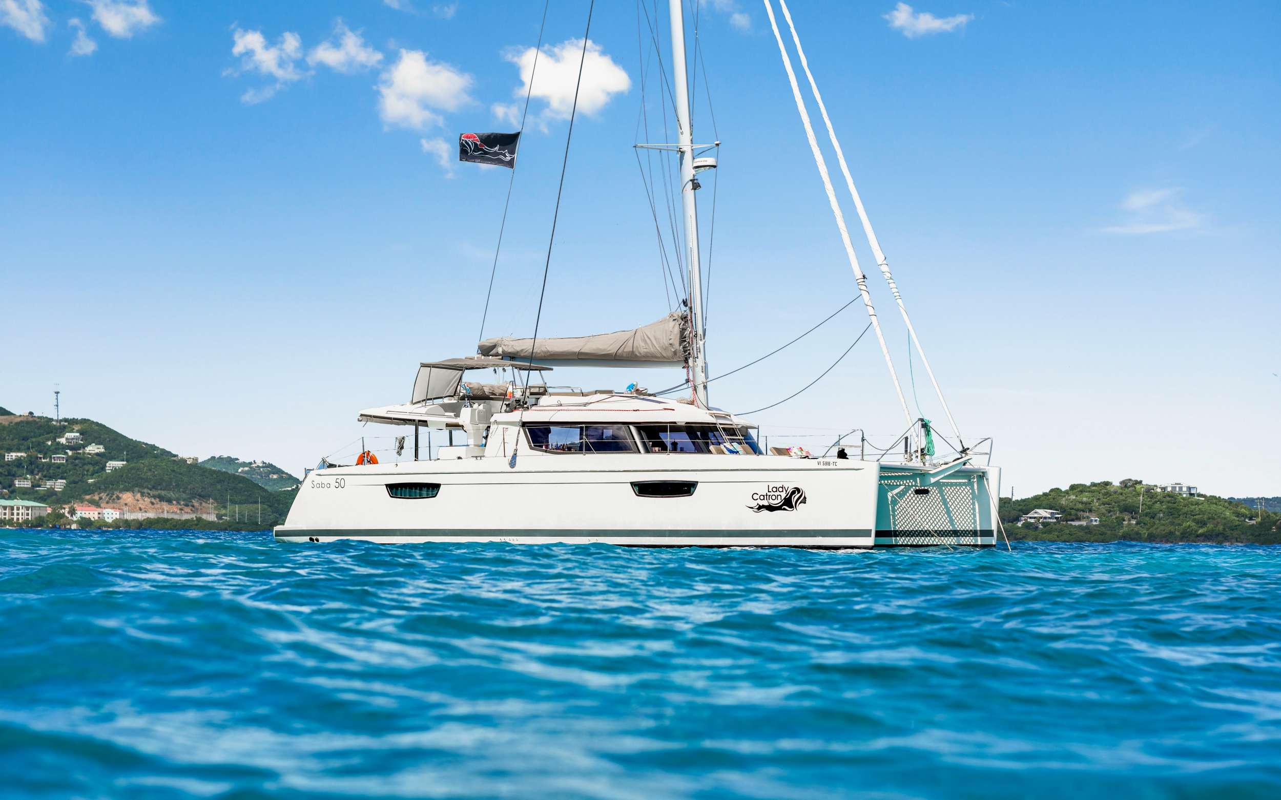 This beautiful 2017 Fountaine Pajot features an upper deck lounge that has sectional couch and sunbed area with 360 degree view. The forward deck has spacious lounge area with adjustable reclining seating, trampolines and sunning areas with an aft deck that offers lounge area plus alfresco dining area. The salon offers lounge area with coffee table plus flat screen TV with many movies and USB capabilities. Upgraded 4 zone sound system provides music throughout all indoor and outdoor areas. For guest comfort, she has three queen cabins and 1 twin cabin, each with private ensuite bath with electric toilet, wash basin and separate shower stall. A spacious master stateroom has desk space, separate toilet room, and a walk-in shower. The twin cabin may be used to accommodate 2 children to make this an 8-guest charter yacht. All cabins have air conditioning, two fans, 110v outlets and dimmable recessed lighting. 

TOYS: 3 Stand Up Paddle Boards, Snorkeling Gear, Floating Mats, 1 Kneeboard, 1 Wakeboard, 1 Subwing, 2 Fishing Rods &amp; Onshore Games.

DIVING: Offered via rendezvous only