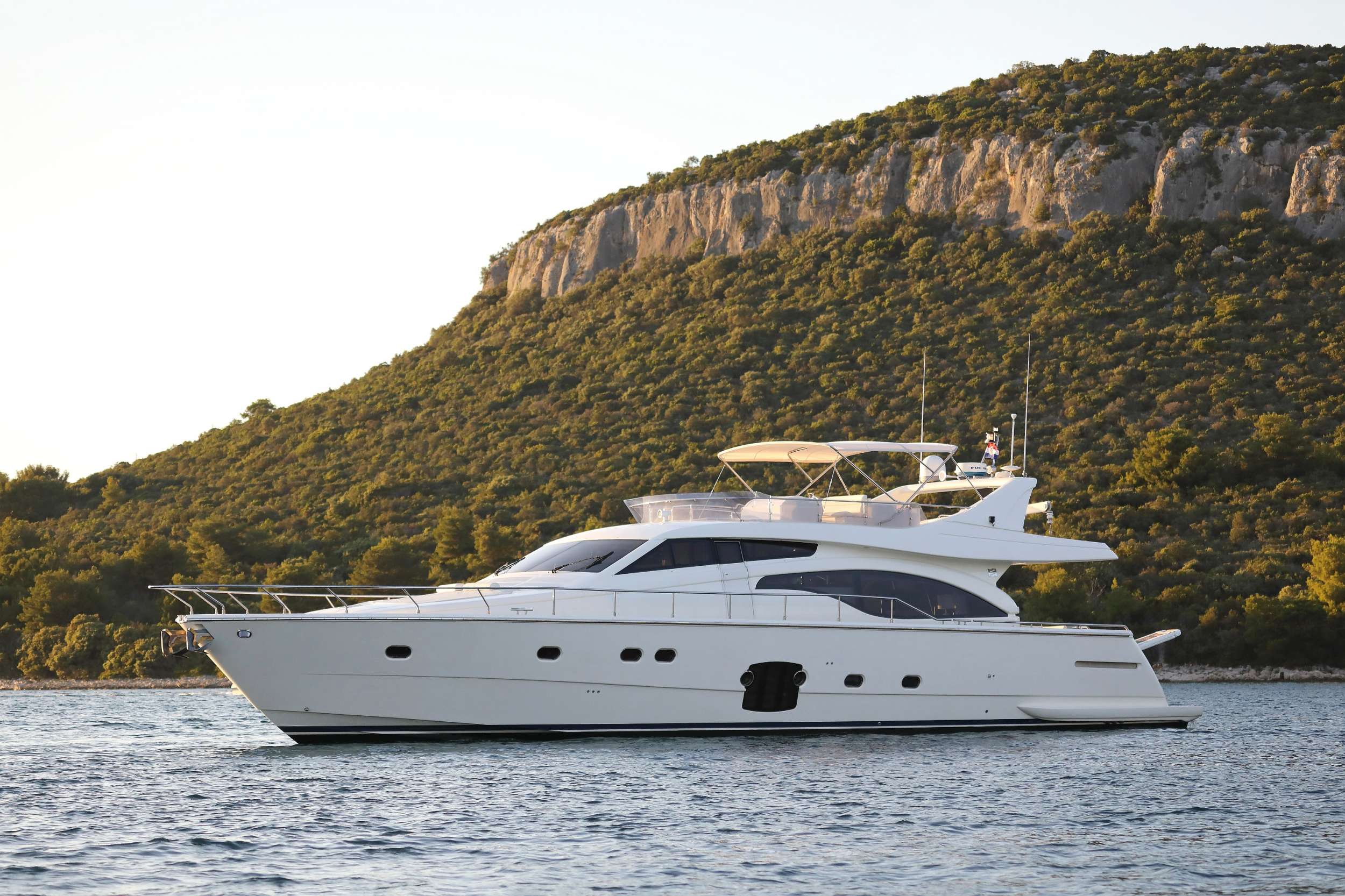 The 21m M/Y DOMINIQUE from the popular Ferretti 681 series is fast, stylish, and ideally suited to a Croatia yacht
charter. Sporting impressive stability and a top speed of 34 knots, guests can explore the stunning Adriatic coast in
luxury.
DOMINIQUE accommodates up to 8 guests in 4 cabins, consisting of a bright and airy full-beam master, a VIP, and
two twin cabins, one with L-shaped bunk beds. The yacht is built for entertaining, with three dining spaces across
the yacht: one in the beautiful split-level salon, one on the aft deck, and a third up on the flybridge, where there is
also a wet bar and sunpads. There&rsquo;s an additional sunbathing space on the bow, while the yacht&rsquo;s swim platform
makes boarding the 3.8m tender or the Seadoo Spark jetski easy.
M/Y DOMINIQUE runs with two permanent crew of captain and stewardess; a chef can also be brought on board
for an additional fee to enhance the gourmet experience on your Adriatic yacht charter.