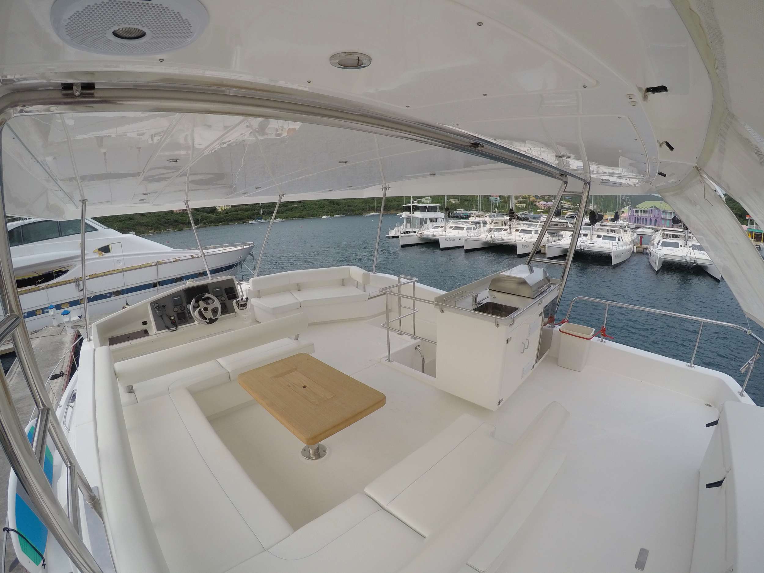 SOMEWHERE HOT Yacht Charter - Flybridge seating with new teak table