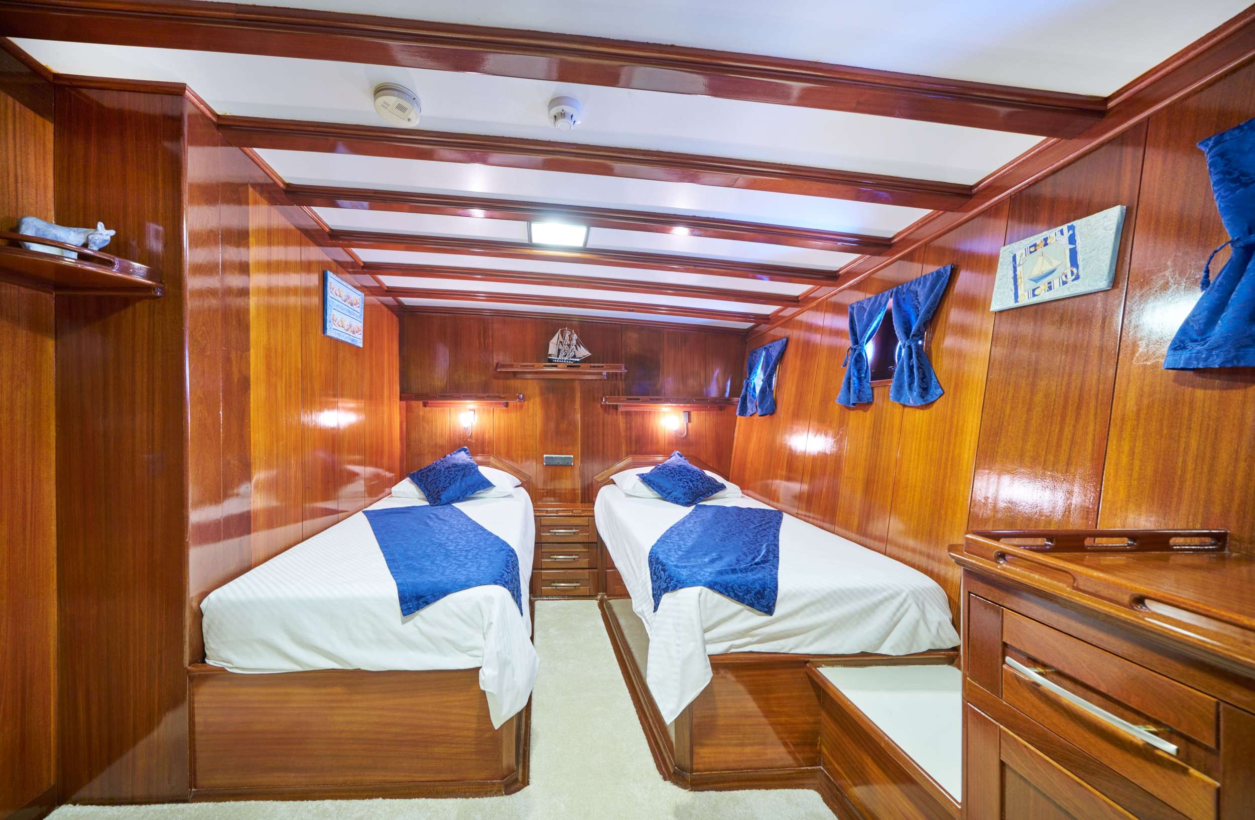 One of two mirror twin bed cabins