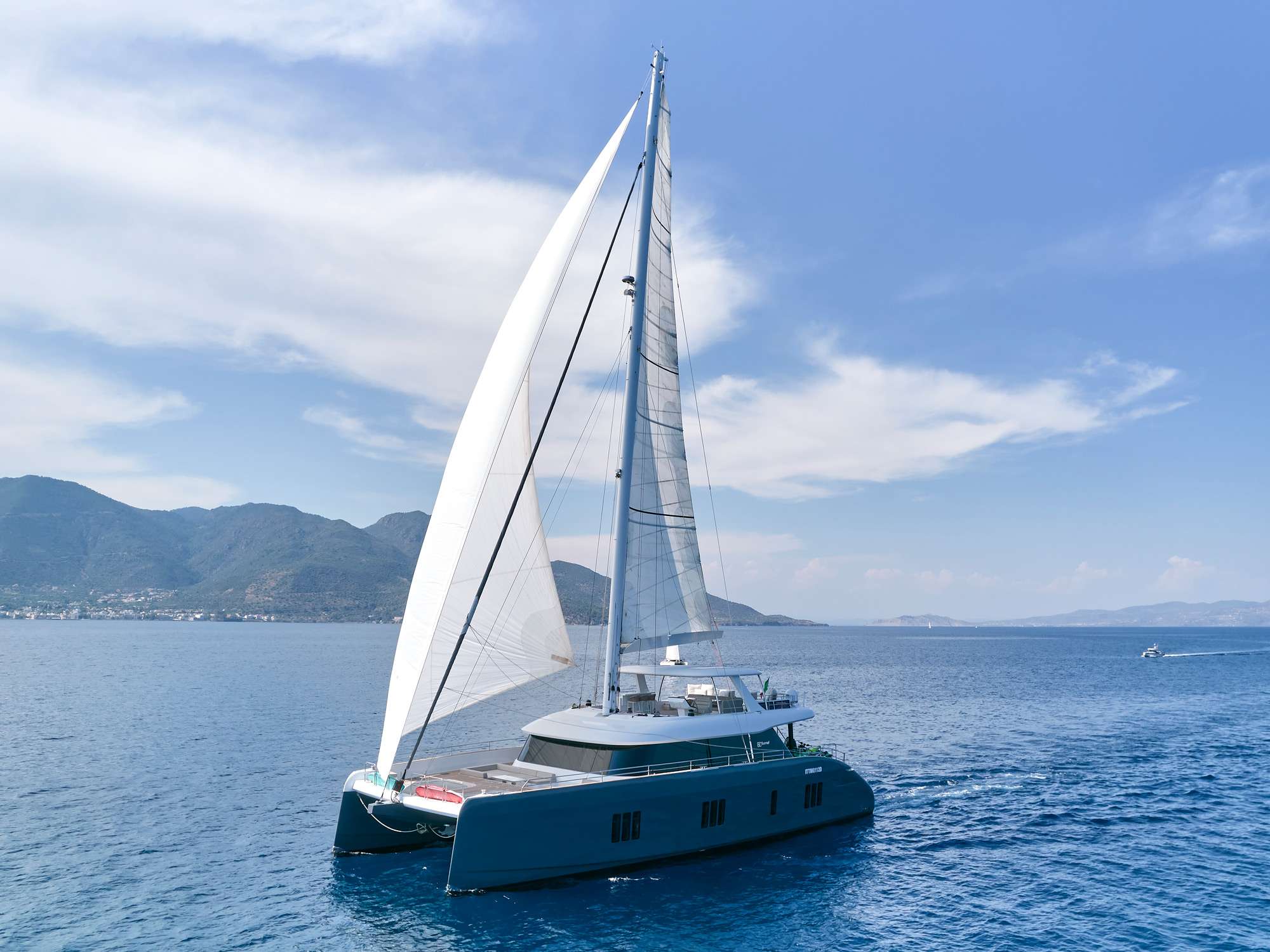 S/Y GENNY is a Sunreef 80 available during the summer to cruise the Greek islands! Step on board this exclusive leisure yacht, an ideal yacht for luxurious getaways, charters and transoceanic adventures. The yacht combines both elegance and superior style. Her exterior spaces are beyond imagination.
S/Y GENNY has classy lines and her modern style with a classic edge. With a completely fresh superstructure concept. A vast, central lounging space with a panoramic view which opens both onto the bow terrace and cockpit. The bow benefits from a cozy lounge, well shielded from sun and wind. To the aft, the saloon merges with the generous cockpit extended with a large aft platform.
All the areas combined form a universal, open environment where flexibility and freedom reign.