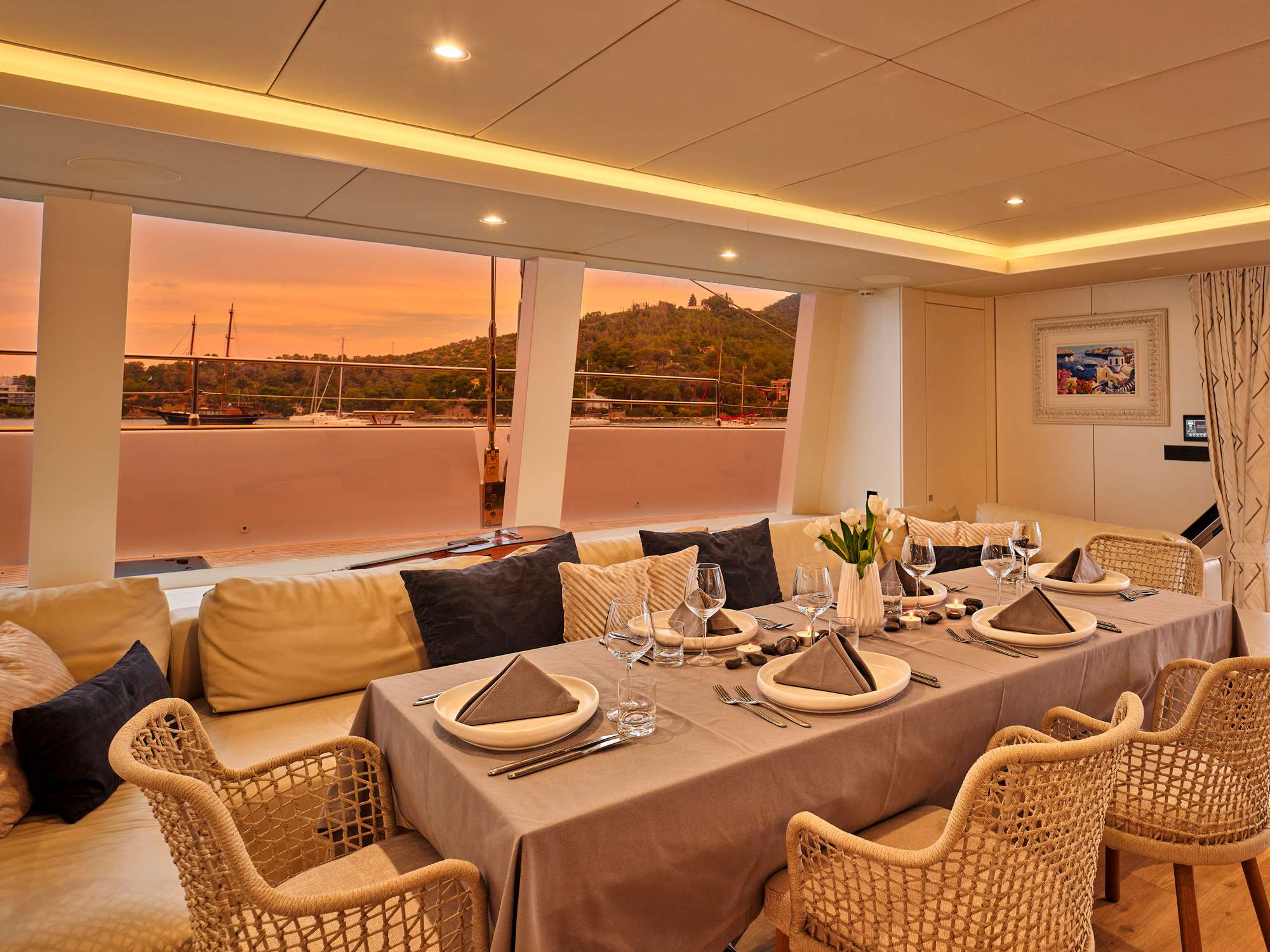 GENNY Yacht Charter - Main saloon convertible table for indoor dining