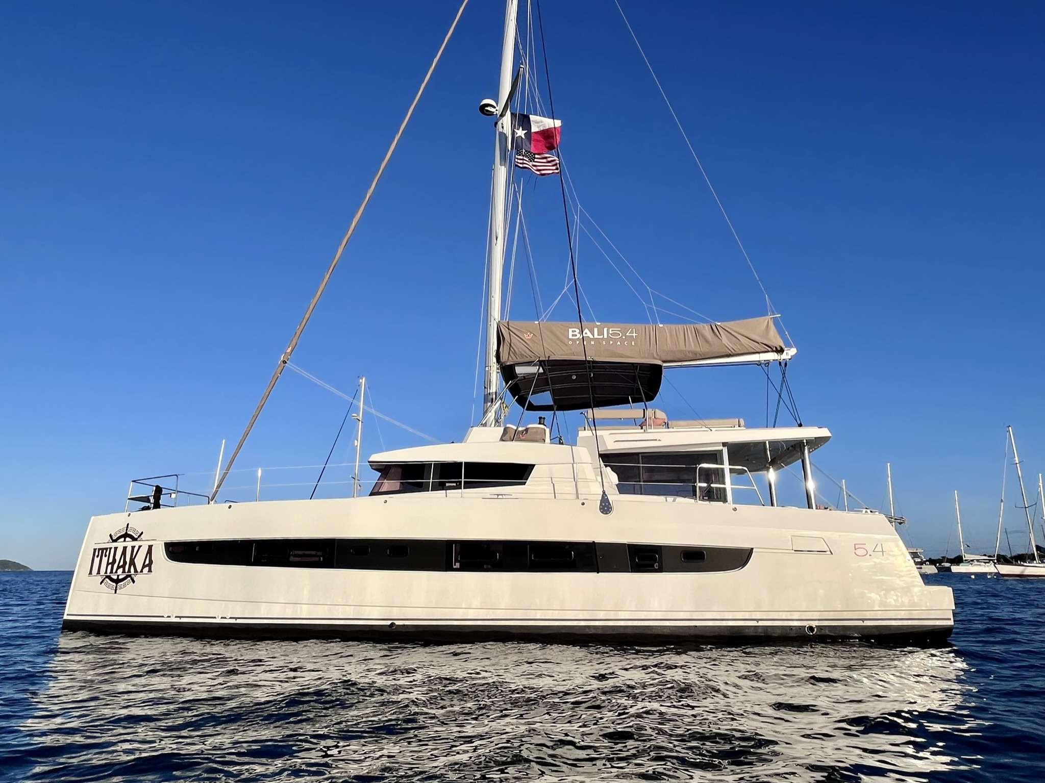 This brand new 2022 luxurious sailing catamaran, ITHAKA, is definitely a fine example of what Bali can design. As you step on board in to a beautifully appointed cockpit, complete with teak floors and dining table for eight and a comfortable lounging bench, you immediately realize what a unique charter experience you are about to have. As you make your way up to the flybridge you&rsquo;ll be blown away by the amazing turquoise water with 360&deg; views and enjoy the up-close view of the sails. It&rsquo;s also a great place to read your favorite book or a favorite spot for appetizers and cocktails at sundown. The main salon is comfortable and luxurious with open spaces and natural light fed by all the windows surrounding you. All four guest cabins are spacious with large windows and offer plenty of natural light. For your comfort, every cabin offers queen sized beds and private baths with dedicated shower stalls as well as flatscreen TVs and a stereo system for both central and individual cabin control. The high level of finishing throughout every cabin reflects the luxury that you would expect from a yacht of this caliber. With all the different areas, ITHAKA is show-stopper and has enough amenities for everyone to enjoy!

TOYS: 2 Stand Up Paddle Boards, Snorkeling Gear, Floating Mat, Tubes 1 Adult Water Ski Set, 1 Kneeboard, 1 Subwing, 2 Sea Scooters, 2 Fishing Rods &amp; Onshore Games.

DIVING: Offered via rendezvous only