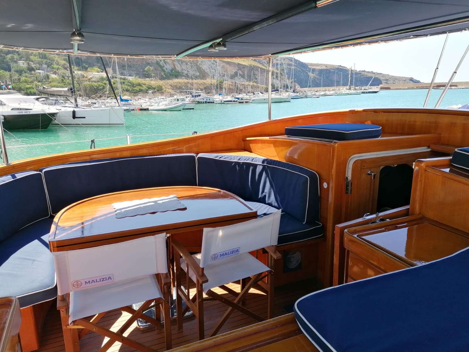 MALIZIA Yacht Charter - Al fresco cockpit area, dining mode