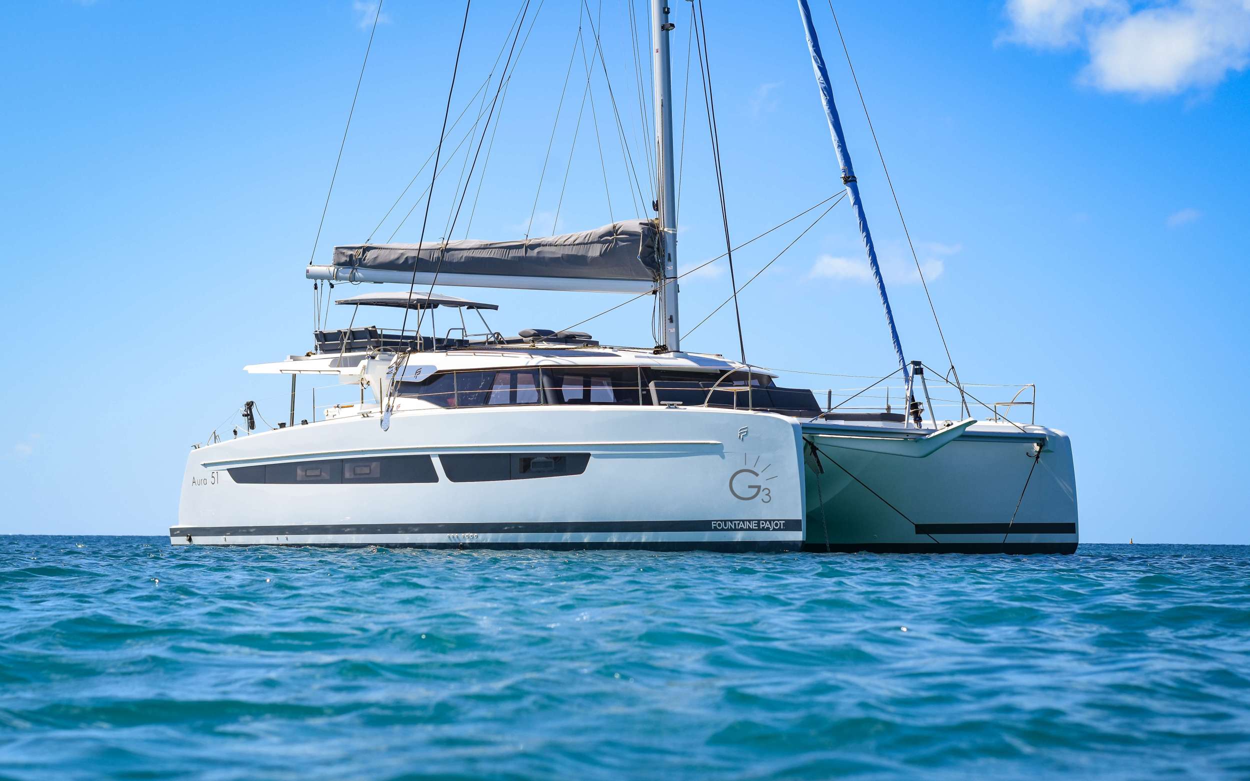 This brand new 2022 51' Fountaine Pajot sailing catamaran is nothing short of extraordinary. G3 takes sailing charter yacht luxury to the next level as she boasts four large queen berths each with private ensuite baths including electric heads, vanity and separate showers. Cabins and yacht common areas offer wonderful natural lighting and great ventilation with full custom air-conditioning. The salon will seat all guests in comfort for lounging or dining with the exterior offering an alfresco dining experience to remember. Top deck seating and villa-style aft lounge area make this charter yacht one-of-a-kind. With numerous lounging areas to stretch out, there is plenty of space for gathering as a group or finding a private place for one or two to take all the Caribbean in.

TOYS: 2 Stand Up Paddle Boards, Snorkeling Gear, 2 Scuba Jets, Floating Mats, 1 Kneeboard, 1 Wakeboard, 1 Subwing, 2 Fishing Rods & Onshore Games.