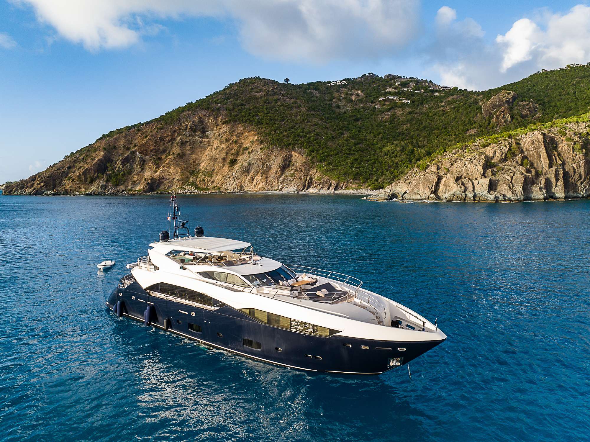 EVEREAST is an outstanding Sunseeker Sport built in 2013 and last refitted in 2022. The main salon has been upgraded to provide a homely and comfortable atmosphere, with folding balconies and sliding glass doors to both port and starboard. She really opens up, allowing maximum light and air into this area. The modern interior is sleek and elegant, incorporating large windows, American black walnut joinery, marble flooring and tops, and glass accents.
EVEREAST's generous interior layout sleeps up to 11 guests in 5 beautifully appointed staterooms, including a main deck master suite, 2 VIP staterooms and 2 twin/convertible staterooms on the lower deck. There is a great team of 7 crew onboard to ensure a relaxed charter experience.
Her generous deck areas play host to a wide range of amenities, including an outdoor bar located on the sundeck, multiple alfresco dining options and a glass-fronted jacuzzi with retractable hood, offering far-reaching views of your surroundings as you relax and unwind. There is also ample space for lounging and relaxing in the bow as you soak up the rays or enjoy some quiet time as the sun sets. EVEREAST's impressive leisure and entertainment facilities make her the ideal charter yacht for entertaining with family and friends.
EVEREAST has a wide range of water toys to keep guests entertained and a hydraulic platform for easy access to the water. Among the water toys, there are towable toys, snorkeling gears and paddle boards along with a Seabob and a Jetski. When it's time to explore your surroundings, it couldn't be easier with the 9 meter chase tender fully equipped.