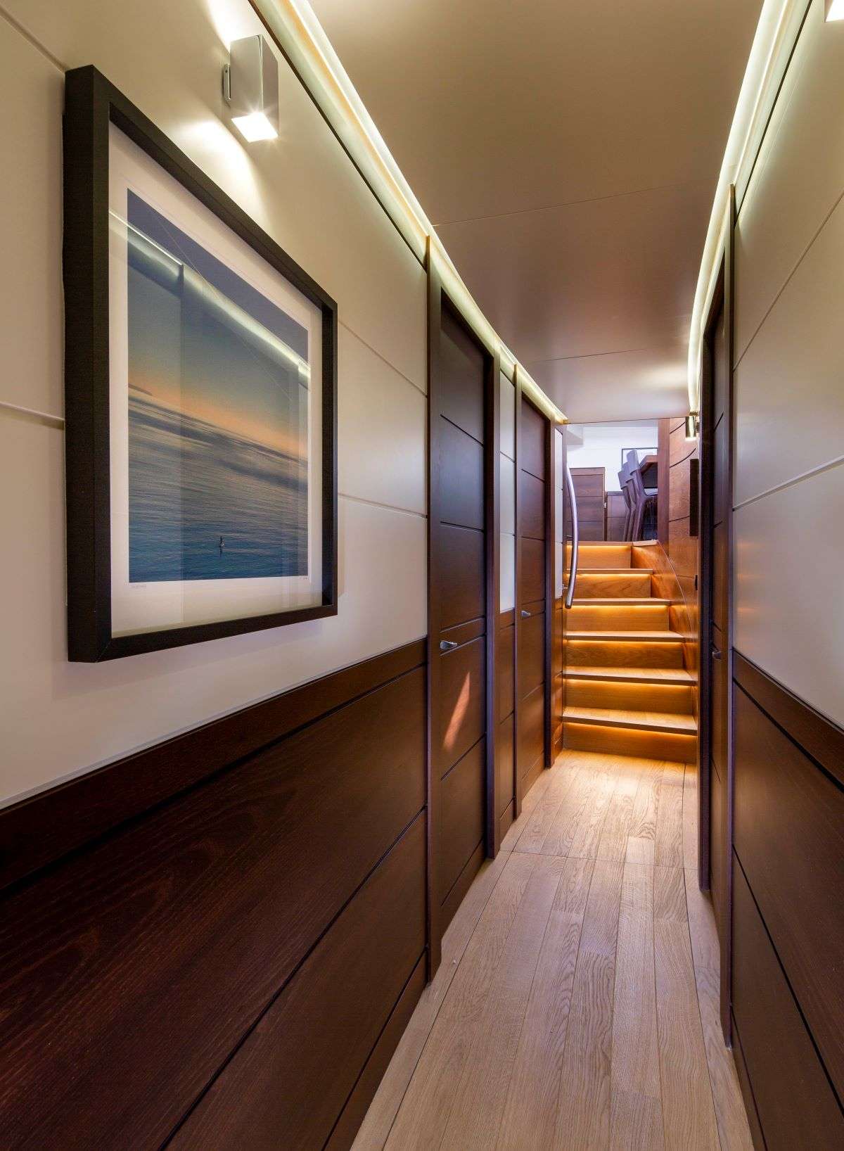 RADIANCE Yacht Charter - Guest hallway - day head on port side at bottom of stairs