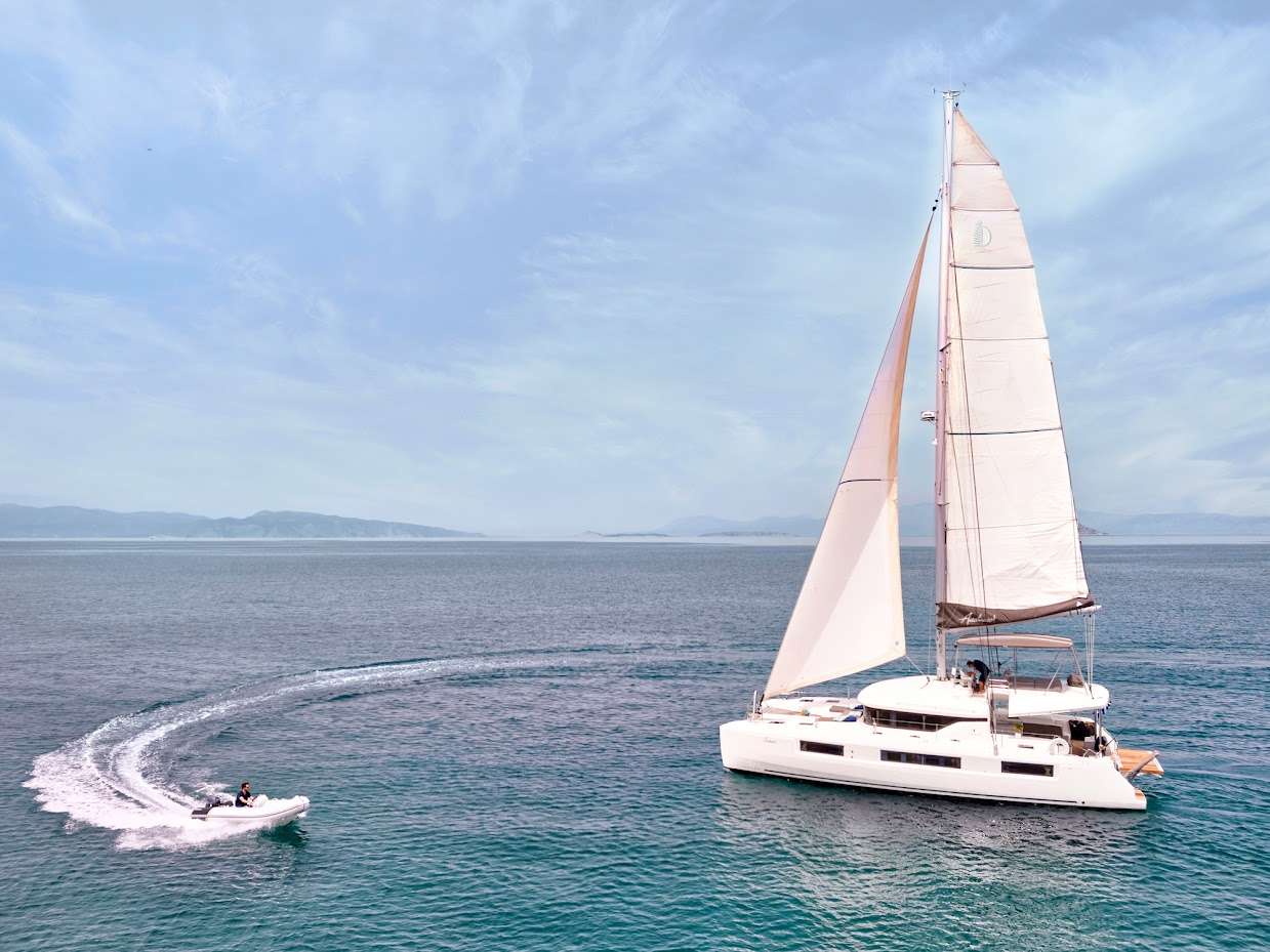 Set sail on a journey of elegance and adventure aboard our luxurious 48.5-foot Lagoon catamaran, a floating oasis designed for up to 10 guests. With its blend of modern design, spacious living areas, and exceptional service, this yacht offers the perfect escape for those who seek both relaxation and exploration.
Accommodating up to 10 guests, this catamaran features five beautifully appointed cabins, each a haven of comfort and style. With four modern showers and thoughtfully designed interiors, you’ll enjoy the perfect balance of privacy and shared experiences. From soft linens to ample storage, every detail has been considered for your ultimate comfort.
Our dedicated and friendly crew is here to make your voyage unforgettable. From crafting gourmet meals to tailoring your itinerary to your preferences, they provide a level of service that is both attentive and unobtrusive. Their warm hospitality ensures a seamless and stress-free experience from start to finish.
Built by the world-renowned Lagoon shipyard, this catamaran embodies innovation and luxury. Its sleek, contemporary design is matched by advanced engineering, delivering exceptional performance and stability. Whether cruising tranquil bays or open waters, every moment onboard is smooth and enjoyable.
Ideal for families, couples, or groups of friends, this yacht is your gateway to unforgettable memories. Swim in crystal-clear waters, explore hidden coves, or simply relax and take in the beauty around you. With ample space for relaxation and entertainment, this Lagoon catamaran offers something for everyone.
Reserve your luxury escape today and experience the magic of the sea aboard our 48.5-foot Lagoon catamaran. Where elegance, adventure, and relaxation come together for the ultimate sailing experience.