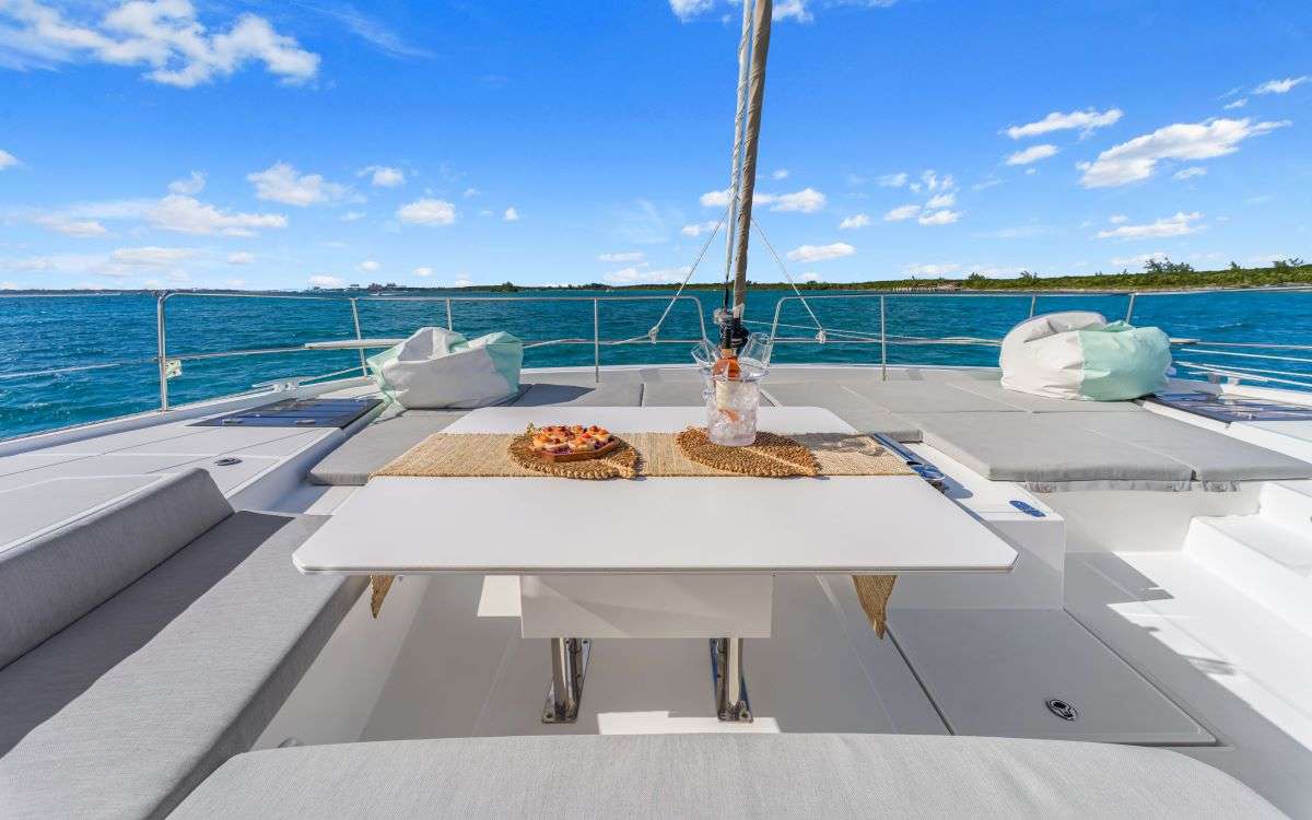 The forward cockpit has a unique rigid front that provides a wonderful lounging area. There is also bench seating with a table to enjoy a meal or snacks.