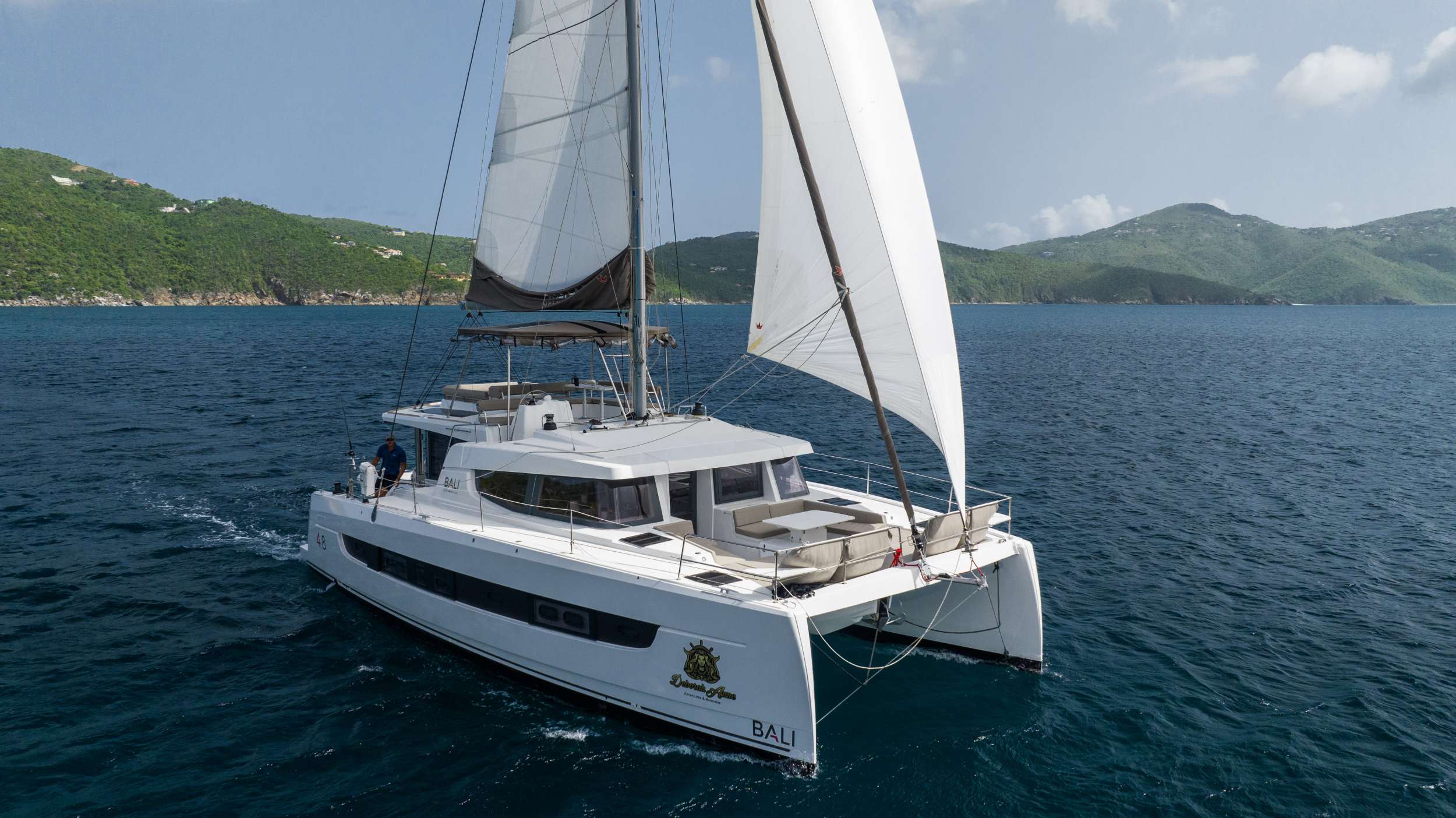 “Escape to the Sea”
Deborah Anne will accommodate 6 charter guests in 2 spacious master cabins and 1 queen cabin, each with their own separate shower and head. She is a 2023 sailing catamaran offering a hydraulic platform, upgraded engines, 2 head sails, solar panels, air conditioning, water maker, ice maker, full sized refrigerator, a fully customizable menu, Caribbean made ecofriendly and reef safe toiletries, a bar stocked to guest preference, coffee/espresso machine, rendezvous scuba diving, snorkeling gear, underwater scooters, subwing, wakeboard, stand up paddle board, towable water tube, 10 ft. floating dock, pool noodles, fishing gear, board and card games, television in the salon, Fusion 3 Bluetooth enabled sound system and Deborah Anne giveaways.