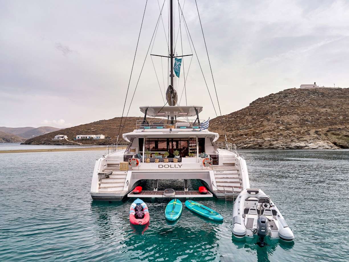 S/Y DOLLY is the ultimate example of luxury in a catamaran, with an expansive flybridge with an authentic ocean terrace and a forward cockpit with ample seating. Enjoy the thrill of sailing or simply unwind on the decadent lounges and sunbathing beds. Her interior is strikingly modern and incredibly spacious, providing the ultimate in comfort and luxury. She accommodates 10 guests in five cabins, including one owner's suite and four queen-sized cabins with private bathrooms and galley up.
The flybridge and forward deck provide plenty of space for sunbathing and relaxing, while the aft cockpit is ideal for socializing and alfresco dining. Our crew, which includes a captain, deck/stew, and chef, is looking forward to spoiling guests on board and fulfilling every wish. S/Y DOLLY is dedicated to providing a relaxing and luxurious environment for all of our distinguished guests.